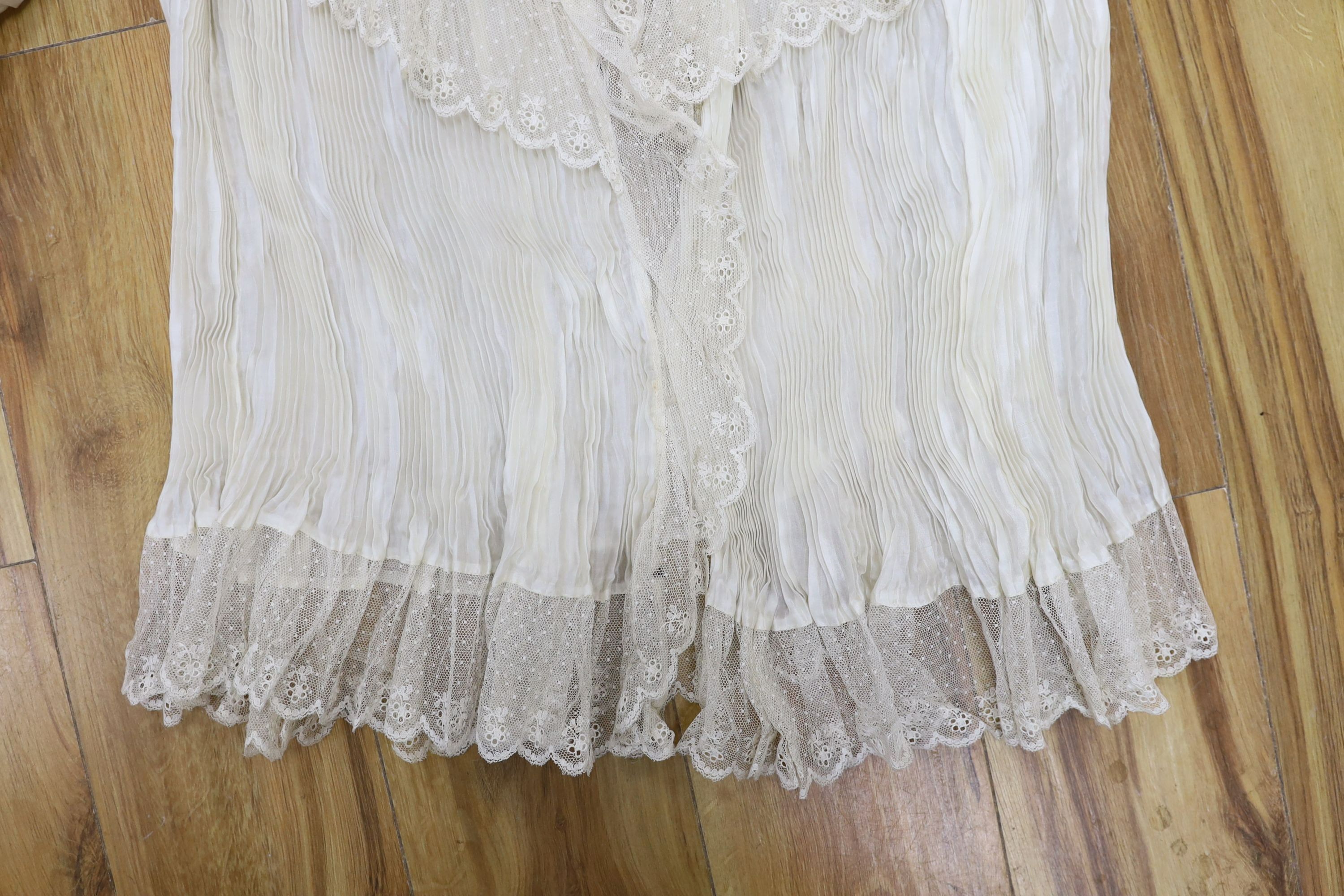 A fine cream silk and lace inserted pleated jacket